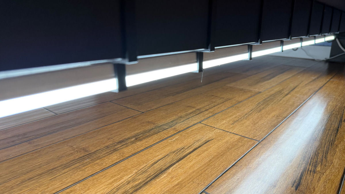 Picture of the brackets installed on the beam of the bed frame, multiple in a row with the light mounted underneath